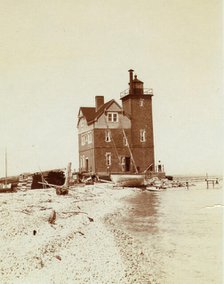 View of lighthouse from beach, Duluth, Minnesota, 1903. Creator: Frances Benjamin Johnston.