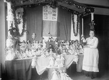 Crown 'Mother' with Exhibit of Dolls, 1915. Creator: Harris & Ewing.