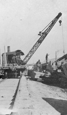 Crane being used in construction of new railway bridge, between c1900 and c1930. Creator: Unknown.