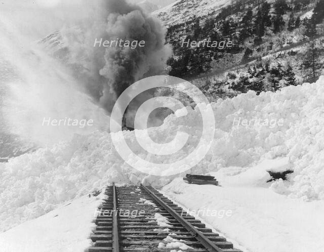 Avalanche of snow across railroad tracks, between 1890 and 1930. Creator: Frank G. Carpenter.
