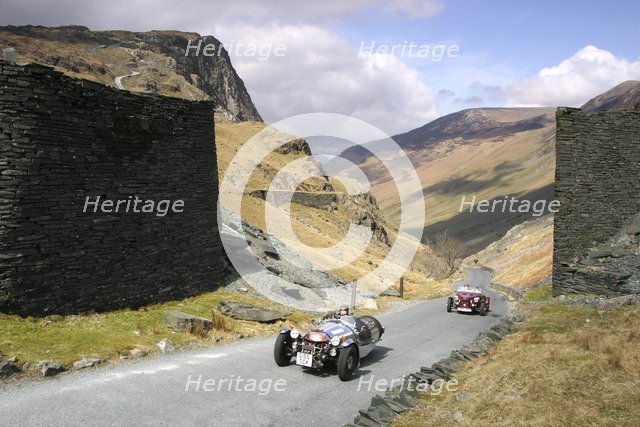 Vintage cars climbing Honister Pass, Lake District, Cumbria.  