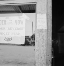 Sign on post office door: Farm animals and household equipment..., Vader, western Washington, 1939. Creator: Dorothea Lange.