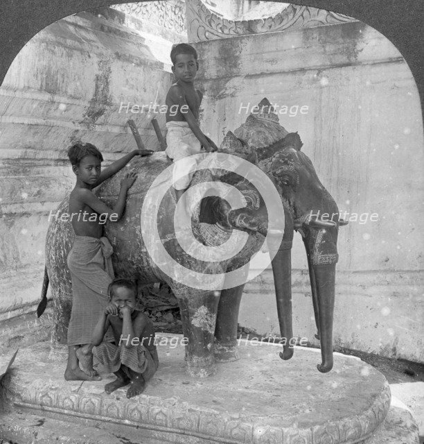 Three headed elephant guarding a sanctuary, Arakan Pagoda, Mandalay, Burma, 1908.  Artist: Stereo Travel Co