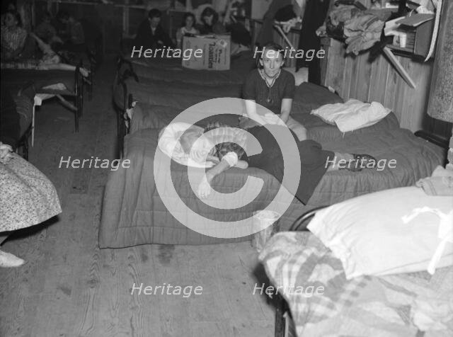 Flood refugees in canning factory used by the Red Cross as a relief..., Mayfield, Kentucky, 1937. Creator: Walker Evans.