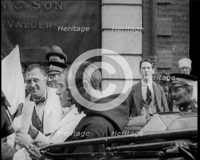 An Irish Priest Talking to a Soldier in a Car, Trying to Bring Peace, 1922. Creator: British Pathe Ltd.
