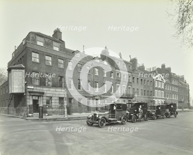 Line of taxis, Abingdon Street, Westminster, London, 1933. Artist: Unknown.
