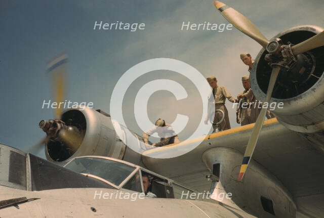 Working on a plane at the Naval Air Base, Corpus Christi, Texas, 1942. Creator: Howard Hollem.