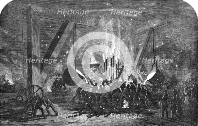 Casting a Monster Cylinder, at Messrs. Scott Russell and Co.'s Building-Yard, Millwall, 1854. Creator: Unknown.