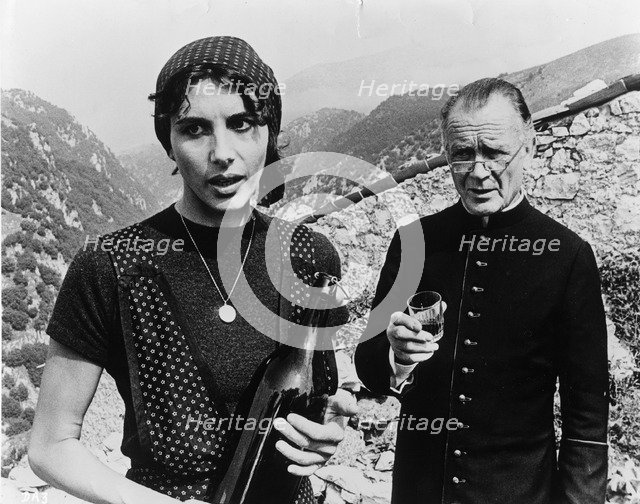 Sir John Mills (1908-), British actor, and Paola Pitagora (1942- ), Italian actress, 1977. Artist: Unknown