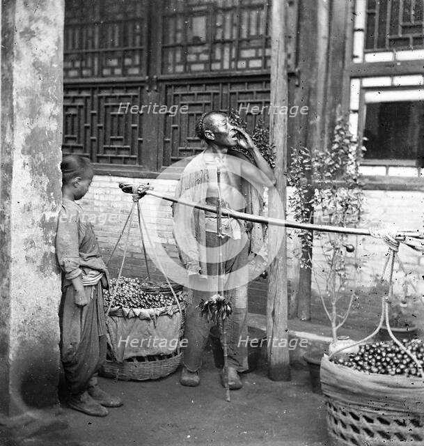 Peking, Pechili province, China: a travelling fruit-seller, 1869. Creator: John Thomson.