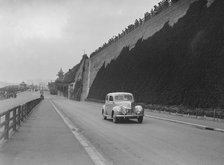 Ford V8 of CGH Barraclough on Madeira Drive, Brighton, RAC Rally, 1939. Artist: Bill Brunell.