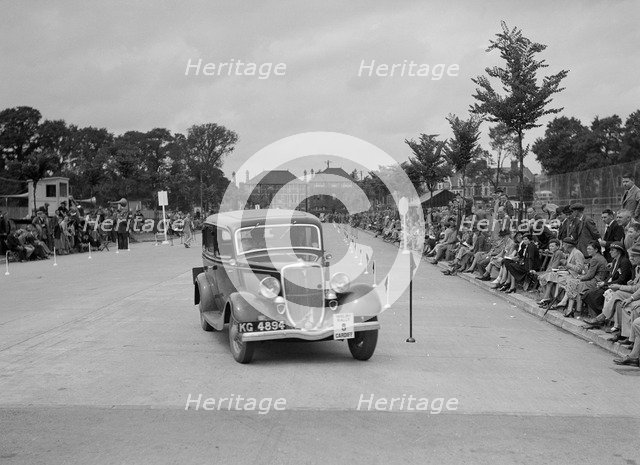 Ford V8 saloon of AE Harris competing in the South Wales Auto Club Welsh Rally, 1937 Artist: Bill Brunell.