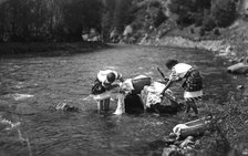 Women washing their laundry in a river, Bistrita Valley, Moldavia, north-east Romania, c1920-c1945. Artist: Adolph Chevalier