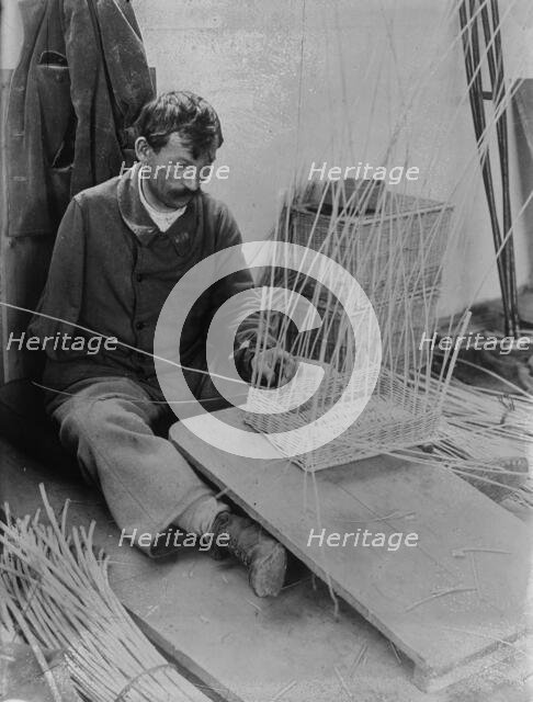 Fernand Bihery [making baskets, French School for crippled soldiers], 1918. Creator: Bain News Service.