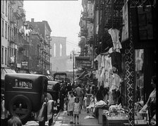 Street View of Street Market Selling Clothes in New York City, 1932. Creator: British Pathe Ltd.