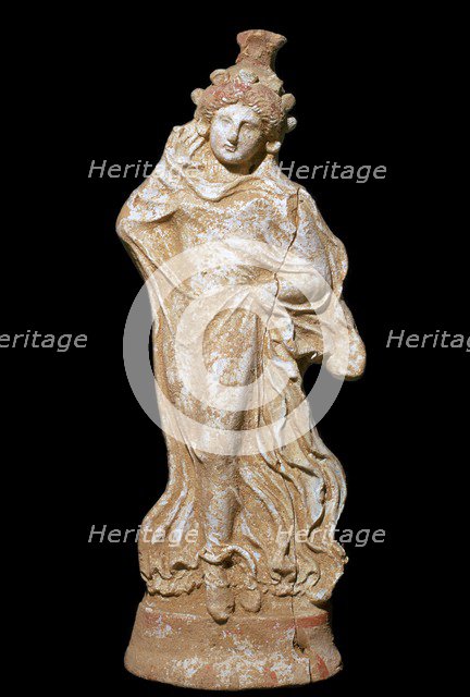 Greek terracotta of a woman in a flowing dress. Artist: Unknown