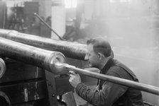 Navy Yard, U.S., Washington - Turning, Examining And Boring A 5 Inch, 50 Cal. Gun, 1917. Creator: Harris & Ewing.