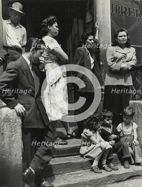Group of men, women and children gathered on stoop, East Harlem, New York City, 1947 - 1951. Creator: Romulo Lachatanere.