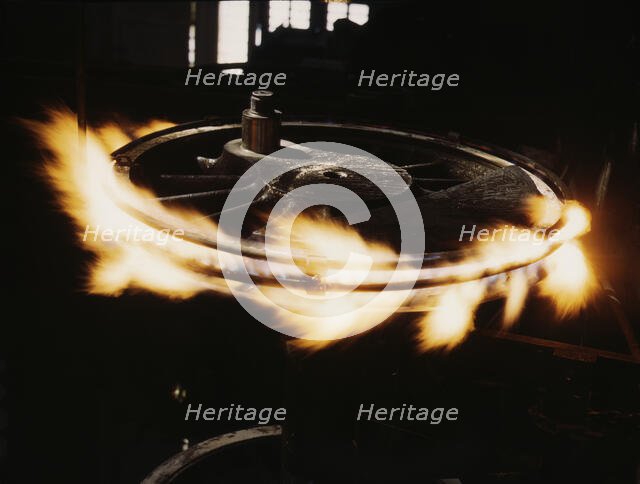 Retiring a locomotive driver wheel, Shopton, Iowa, 1943. Creator: Jack Delano.