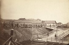 Group of convicts at head of inclined plane leading to barge, between 1885 and 1886. Creator: Unknown.