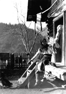 Woman spinning wool, Bistrita Valley, Moldavia, north-east Romania, c1920-c1945. Artist: Adolph Chevalier
