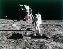 Buzz Aldrin sets up the seismic experiment, Apollo II mission, July 1969.  Creator: Neil Armstrong.