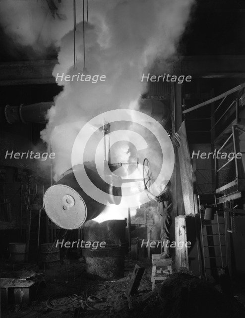 Teeming (pouring) molten iron at Edgar Allen's steel foundry, Sheffield, South Yorkshire, 1964. Artist: Michael Walters