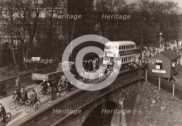 Staff leaving work at lunchtime, Rowntree factory, York, Yorkshire, 3 March 1938. Artist: Unknown