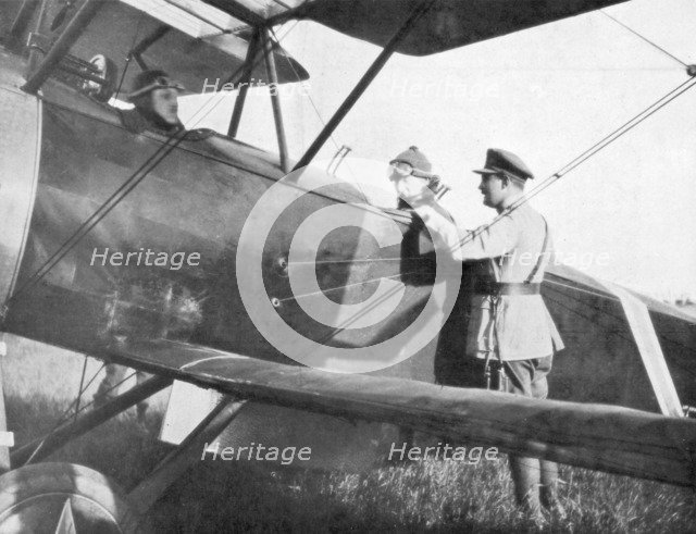Albert I of Belgium, leaving by plane to visit the lines of the Yser, c1917. Artist: Unknown