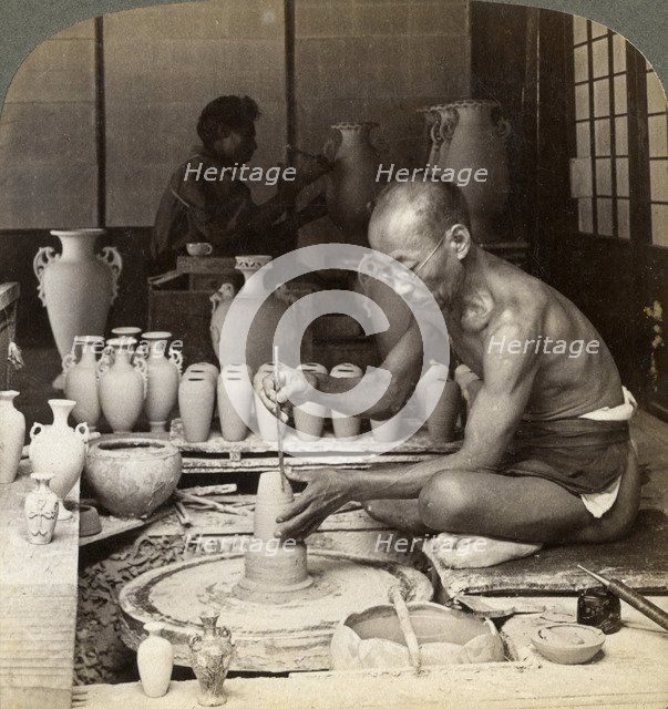A potter and his wheel, fashioning a vase of Awata porcelain, Kinkosan works, Kyoto, Japan, 1904. Artist: Underwood & Underwood