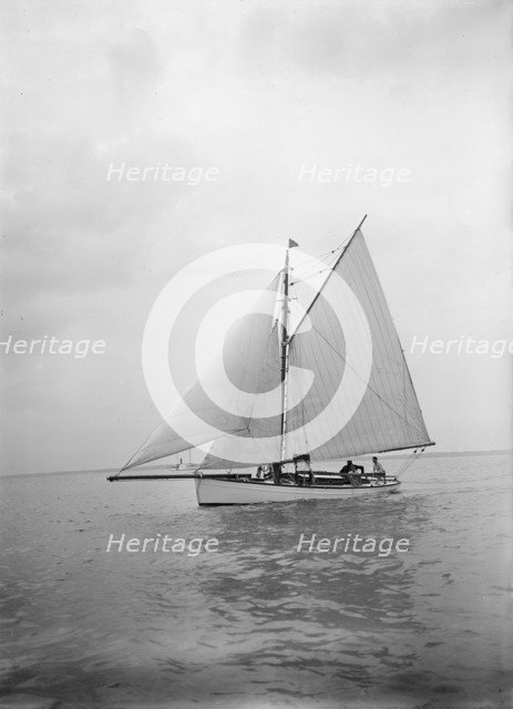 The cutter 'Blue Bird' under sail, 1934. Creator: Kirk & Sons of Cowes.