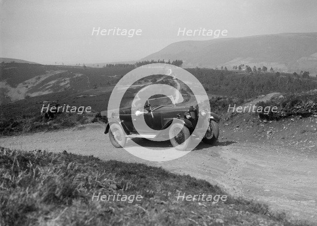 Kitty Brunell road testing a Riley 9 WD tourer, c1930. Artist: Bill Brunell.