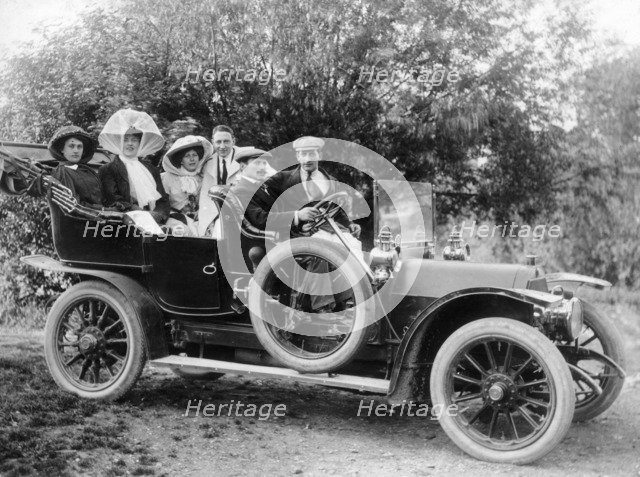 A group of men and women taking an outing in a 1907 Mercedes, 1908. Artist: Unknown