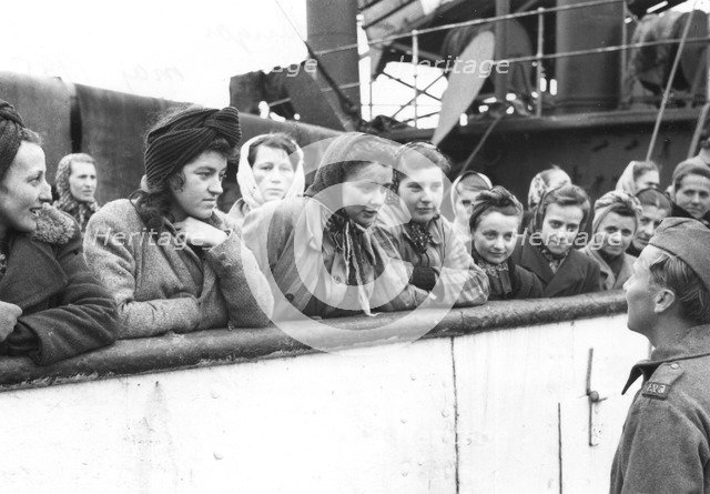 Women talking to a soldier, Trelleborg harbour, Sweden, May 1945. Artist: Unknown