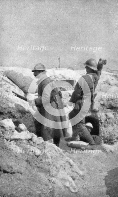 Life in the trenches in Champagne; The outpost re-arms immediately..., 1917. Creator: Unknown.