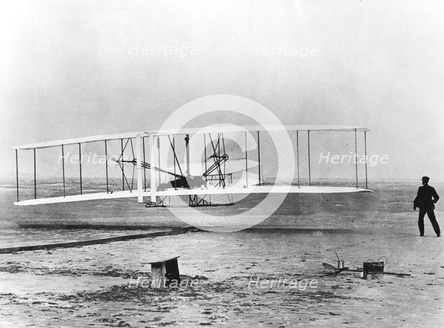 Wilbur and Orville Wright and the first powered flight, North Carolina, December 17 1903. Artist: Unknown