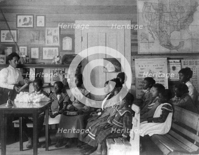African American children and teacher in classroom studying..., Annie Davis School...Alabama, c1902. Creator: Frances Benjamin Johnston.
