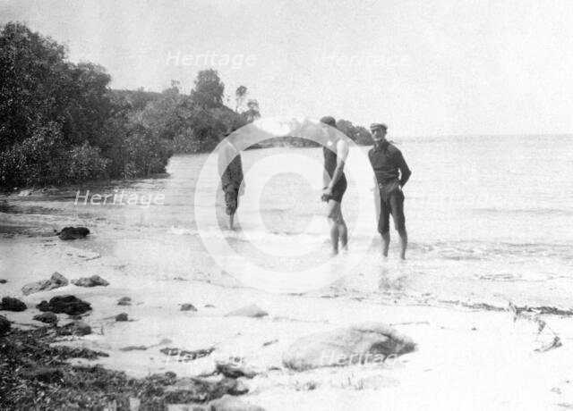 Men in swimming costumes at the water's edge, possibly at the mouth of the Tweed River, 1910. Creator: Robert Augustus Henry L'Estrange.