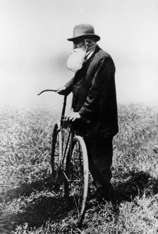 John Boyd Dunlop with bicycle, July 1918. Artist: Unknown