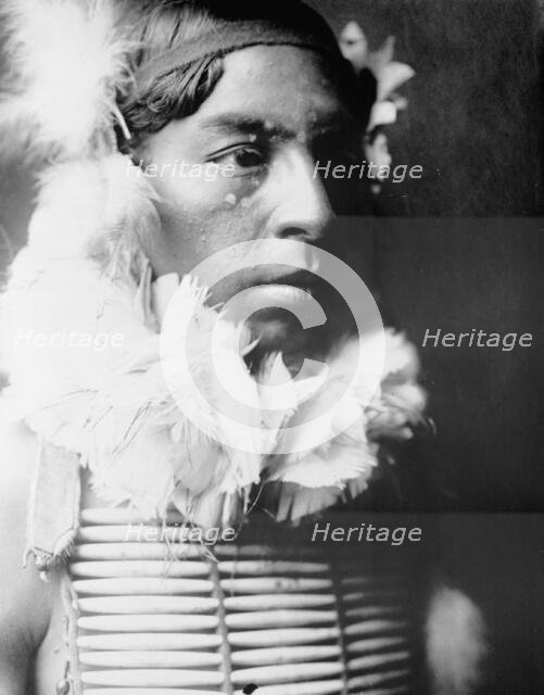 The Dancer, Crow Indian, head-and-shoulders portrait, facing right, c1905. Creator: Edward Sheriff Curtis.