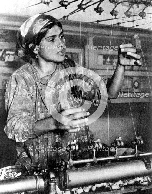 Woman working in the silk industry, Samarkand, Uzbekistan, 1936. Artist: Unknown