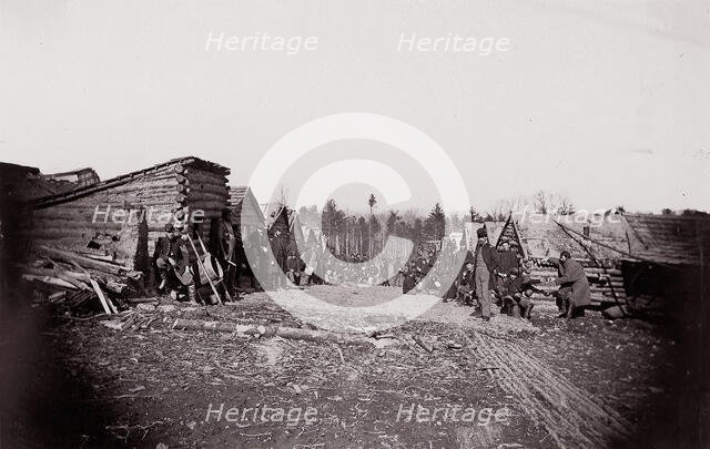 [Winter Quarters, troops with row of cabins]. Brady album, p. 128, 1861-65. Creator: Unknown.