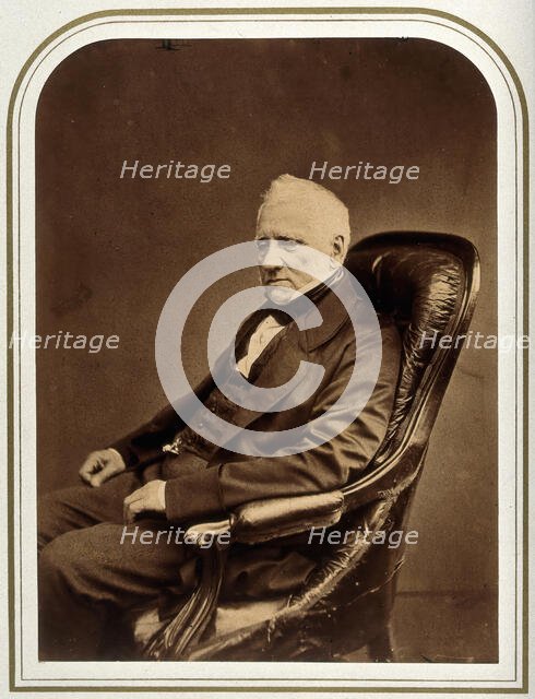 An unidentified man in an armchair. Creator: Maull & Polyblank.