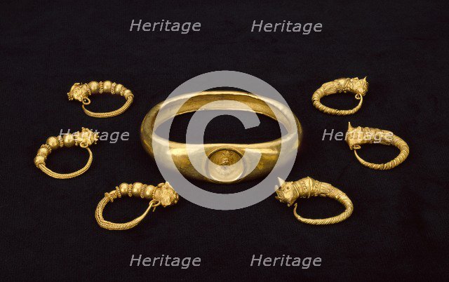 Gold earrings and gold armlet, fom a temple treasure, 4th-3rd century BC. Artist: Unknown.