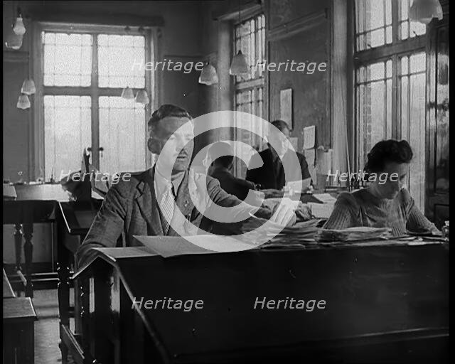 People Working in an Office, 1940. Creator: British Pathe Ltd.