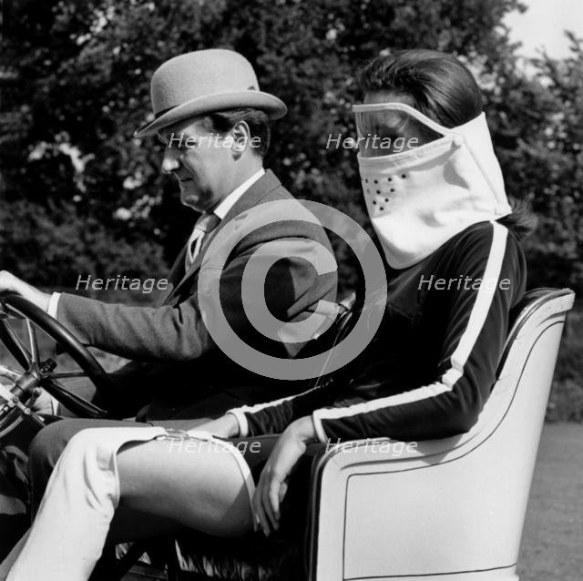 Patrick Macnee & Diana Rigg in 1905 Vauxhall filming the Avengers at Beaulieu 1966. Creator: Unknown.