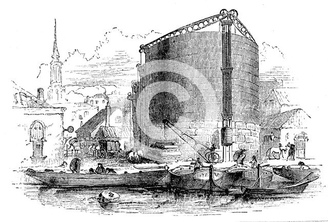 Exterior view of City of London Gasworks, showing gasometers and coal barges at the quay, 1876. Artist: Unknown