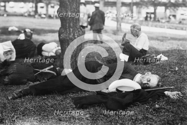 Asleep in Battery Park on hot day, between c1910 and c1915. Creator: Bain News Service.