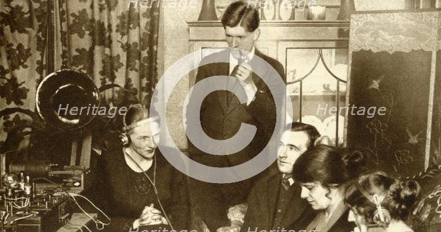 A family listening to the results of the general election of 1923, (1935).  Creator: Unknown.