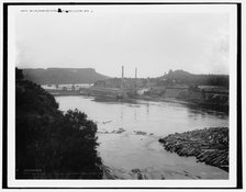 Mills from railroad bridge, Eau Claire, Wis., between 1880 and 1899. Creator: Unknown.